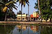 Kerala backwaters, our three hours neighborhood tour in the narrow canoe towards Vembanad Lake and along one of the  narrow canal running near our guest house at Kumarakom. 